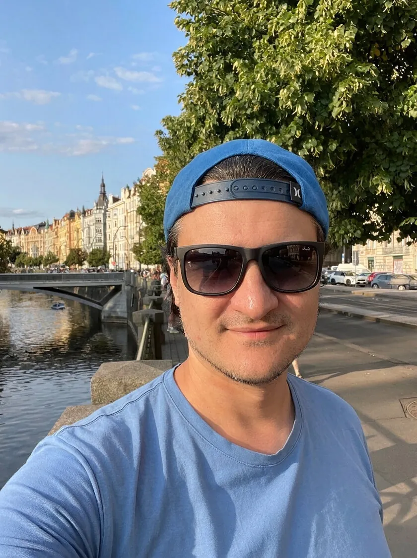 Andry, founder of CozyRelic, by the river in Prague